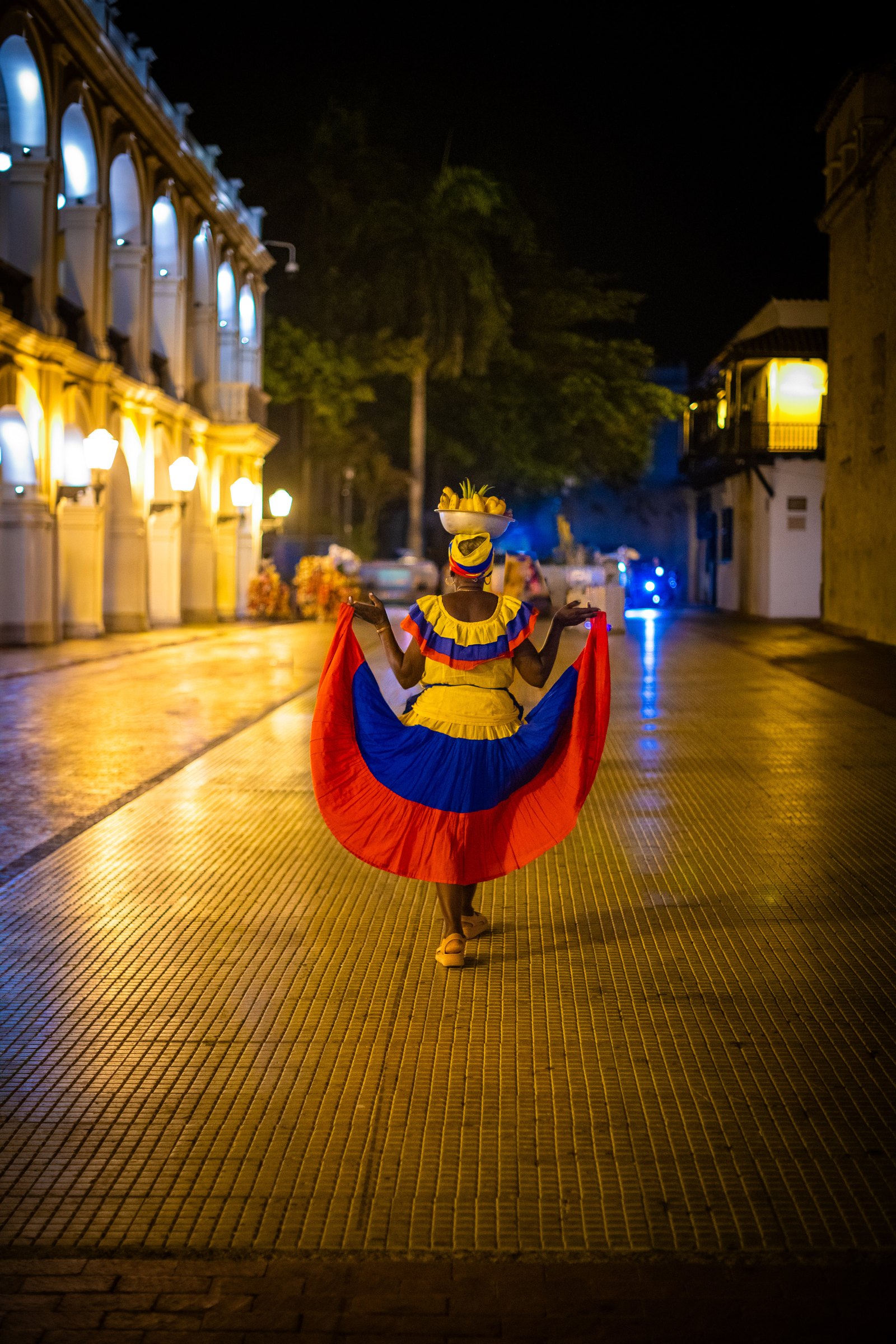 Palenquera at Night, fine art photograph by Marcello Martins in Cartagena, Colombia